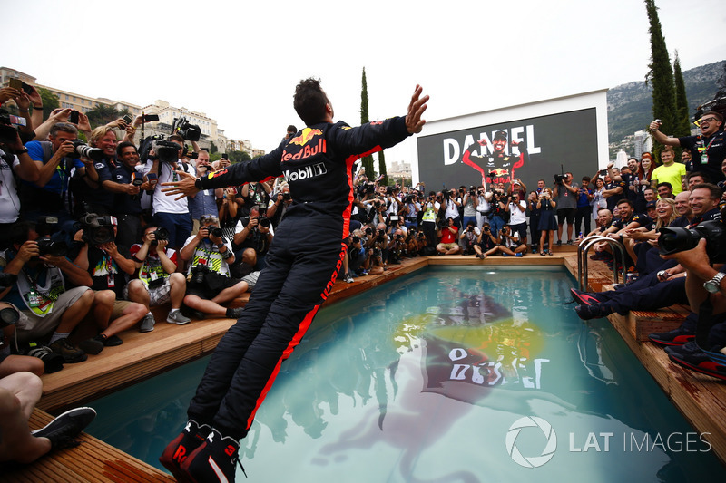 Daniel Ricciardo, Red Bull Racing, dives into the swimming pool on the Red Bull Energy Station