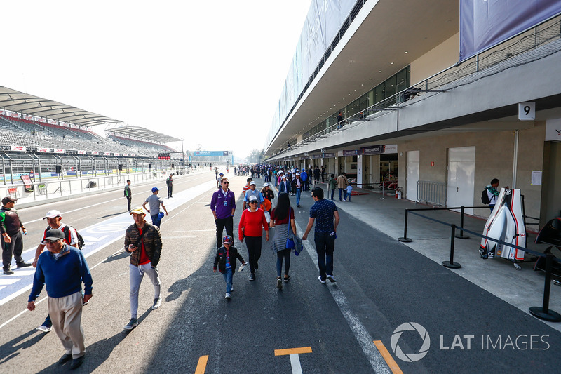 Fans walking through the pitlane