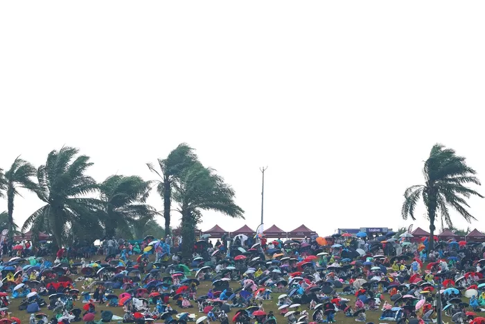 Fans under the umbrellas