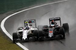 (L to R): Valtteri Bottas, Williams FW38 and Fernando Alonso, McLaren MP4-31 battle for position