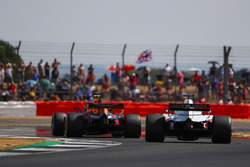 Max Verstappen, Red Bull Racing RB14, leads Romain Grosjean, Haas F1 Team VF-18