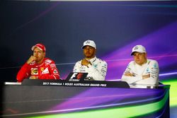Sebastian Vettel, Ferrari, Lewis Hamilton, Mercedes AMG, and Valtteri Bottas, Mercedes AMG, in the post qualifying Press Conference