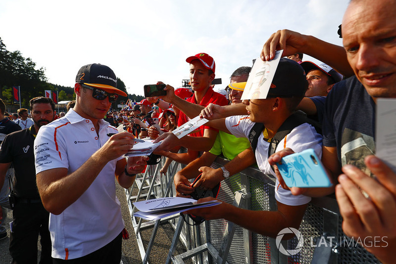 Stoffel Vandoorne, McLaren, signs autographs for fans