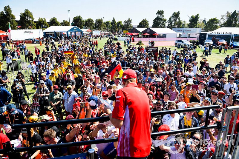 Sebastian Vettel, Ferrari signs autographs