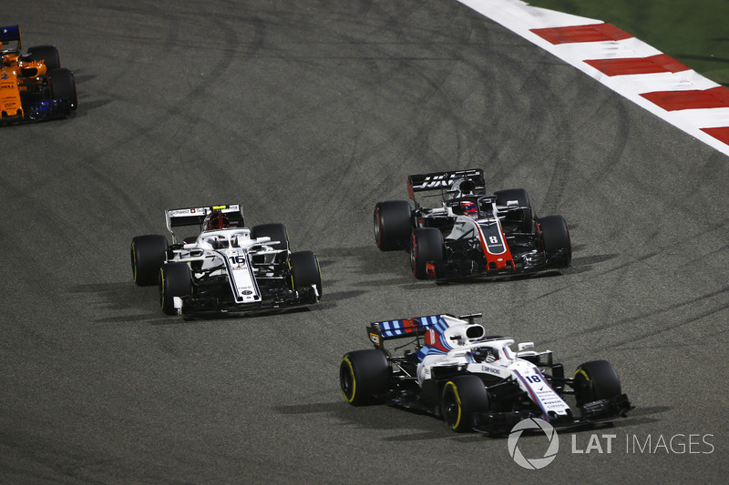 Lance Stroll, Williams FW41 Mercedes, leads Charles Leclerc, Sauber C37 Ferrari, Romain Grosjean, Ha