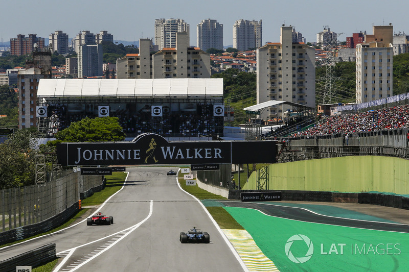 Sebastian Vettel, Ferrari SF70H exits the pitlane ahead of Valtteri Bottas, Mercedes-Benz F1 W08