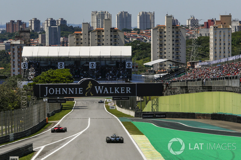 Sebastian Vettel, Ferrari SF70H exits the pitlane ahead of Valtteri Bottas, Mercedes-Benz F1 W08 