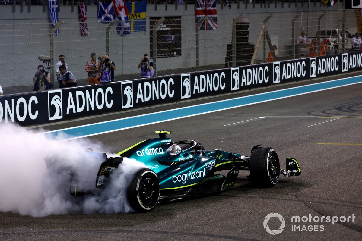 Sebastian Vettel, Aston Martin AMR22, performs donuts on the grid at the end of the race