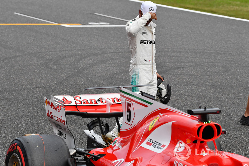 Lewis Hamilton, Mercedes AMG F1 looks at the Ferrari SF70H in parc ferme