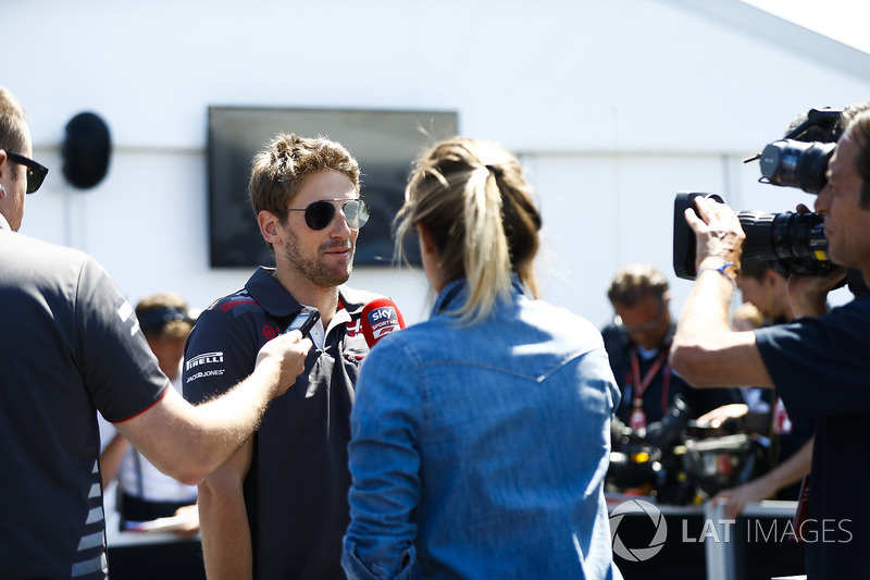 Romain Grosjean, Haas F1 Team, talks to the media in qualifying