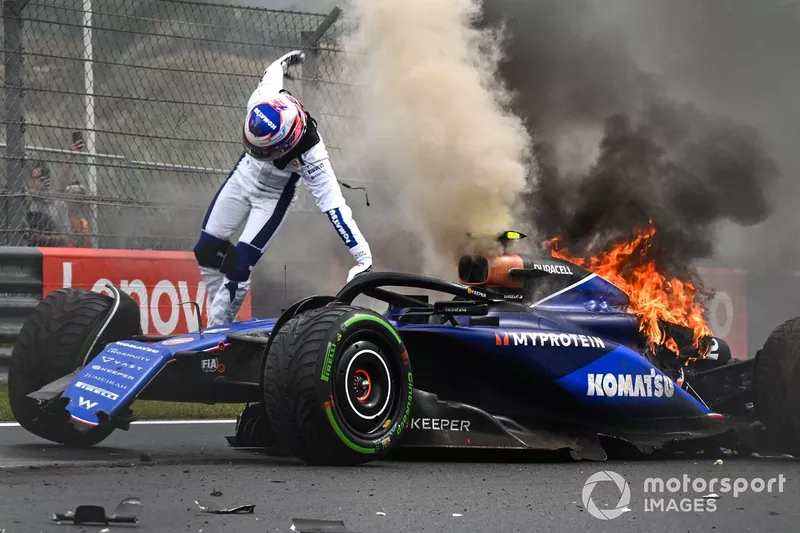 Logan Sargeant, Williams FW46, jumps out of his car after a crash