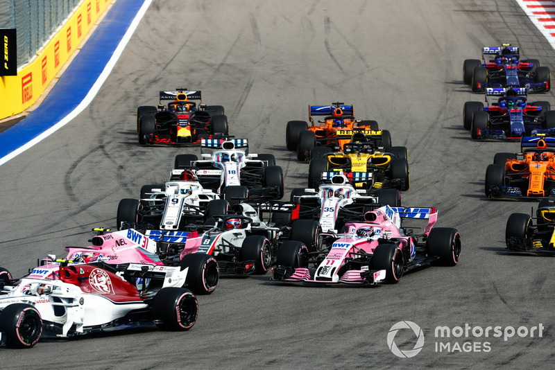 Charles Leclerc, Sauber C37, leads Esteban Ocon, Racing Point Force India VJM11, Romain Grosjean, Haas F1 Team VF-18, Sergio Perez, Racing Point Force India VJM11, Marcus Ericsson, Sauber C37, and the remainder of the field at the start of the race