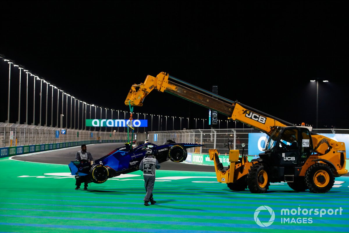 Marshals remove the damaged car of Nicholas Latifi, Williams FW44, from the circuit