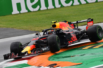 Max Verstappen, Red Bull Racing RB14 jumps over the kerb