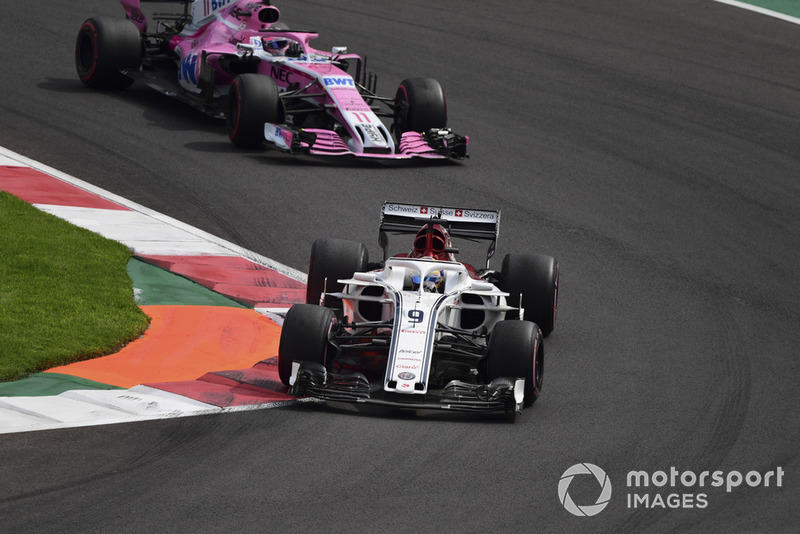 Marcus Ericsson, Sauber C37 and Sergio Perez, Racing Point Force India VJM11