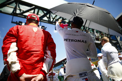 Kimi Raikkonen, Ferrari, and Lewis Hamilton, Mercedes AMG F1, on the grid