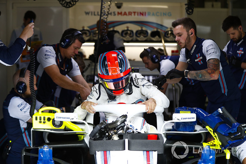 Robert Kubica, Williams FW41, climbs out of his car