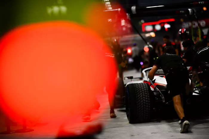 The Haas F1 pit crew practice a pit stop