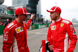 Pole sitter Sebastian Vettel, Ferrari, talks to Kimi Raikkonen, Ferrari