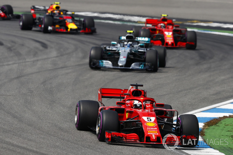 Sebastian Vettel, Ferrari SF71H, leads Valtteri Bottas, Mercedes AMG F1 W09, Kimi Raikkonen, Ferrari SF71H, and Max Verstappen, Red Bull Racing RB14