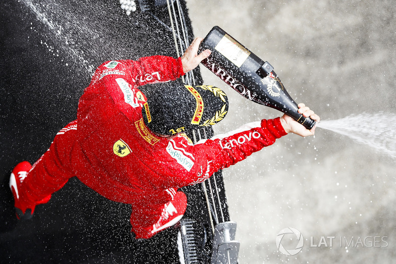 Sebastian Vettel, Ferrari, 1st position, sprays Champagne on the podium