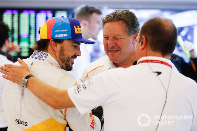 Fernando Alonso, McLaren, and Zak Brown, Executive Director, McLaren Racing, in the garage