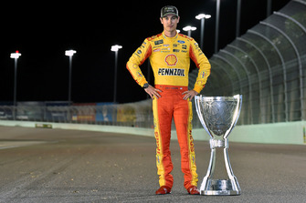 Joey Logano, Team Penske, Ford Fusion Shell Pennzoil with his Championship trophy