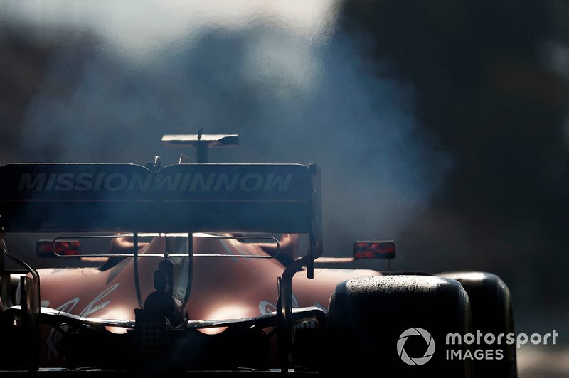 Smoke from the rear of Charles Leclerc, Ferrari SF90