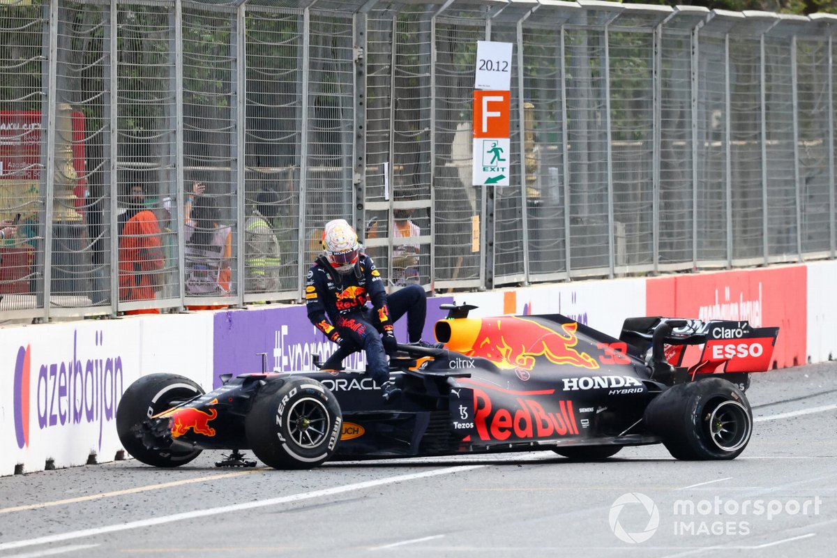 Max Verstappen, Red Bull Racing, climbs out of his car after crashing out from the lead