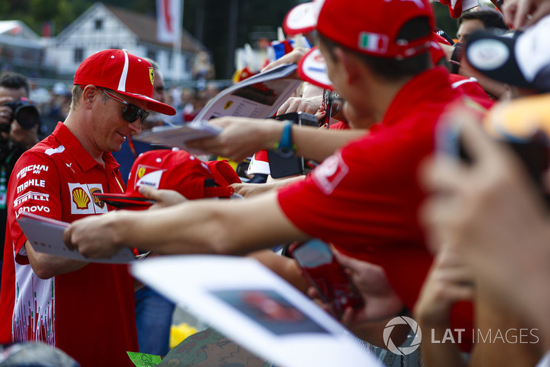 Kimi Raikkonen, Ferrari, signs autographs for fans