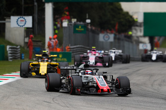 Romain Grosjean, Haas F1 Team VF-18, leads Carlos Sainz Jr., Renault Sport F1 Team RS 18, and Esteban Ocon, Racing Point Force India VJM11