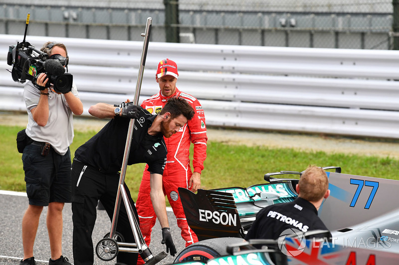 Sebastian Vettel, Ferrari and Mercedes AMG F1 mechanic in parc ferme