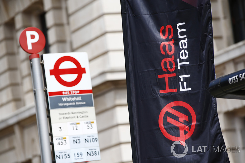 A Haas F1 Team banner next to a bus stop in Whitehall