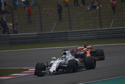 Felipe Massa, Williams FW40, leads Stoffel Vandoorne, McLaren MCL32