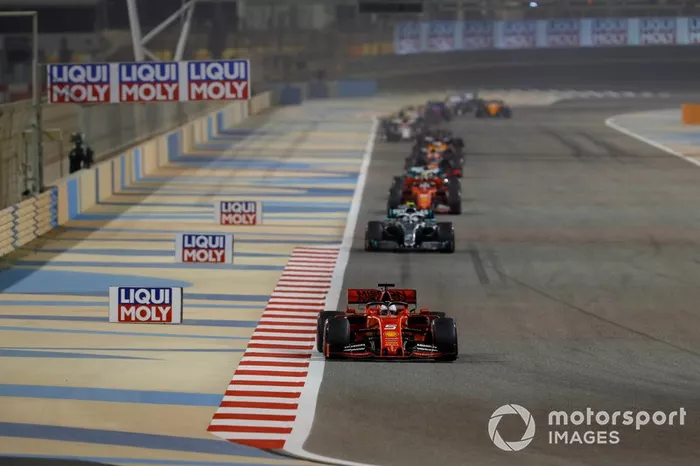 Sebastian Vettel, Ferrari SF90, leads Valtteri Bottas, Mercedes AMG W10, and Charles Leclerc, Ferrari SF90