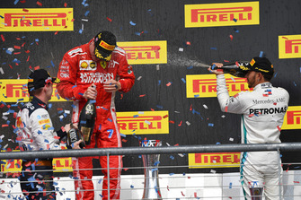 Max Verstappen, Red Bull Racing, Kimi Raikkonen, Ferrari and Lewis Hamilton, Mercedes AMG F1 celebrate on the podium with the champagne