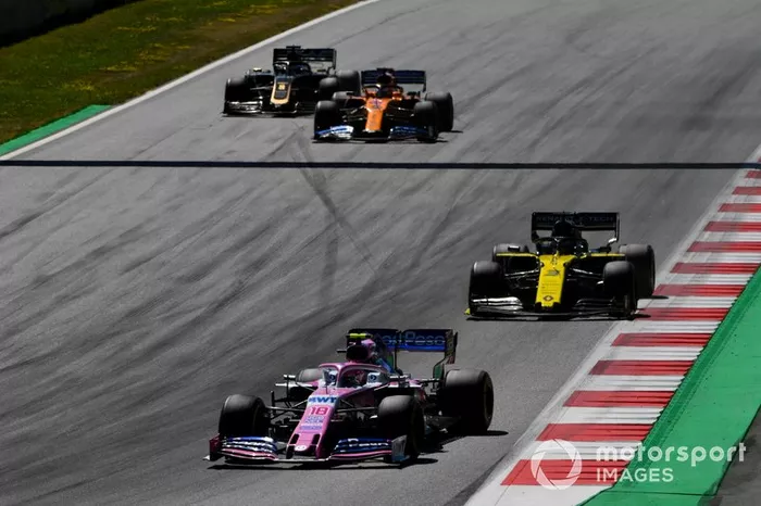 Lance Stroll, Racing Point RP19, leads Daniel Ricciardo, Renault F1 Team R.S.19, Carlos Sainz Jr., McLaren MCL34, and Romain Grosjean, Haas F1 Team VF-19