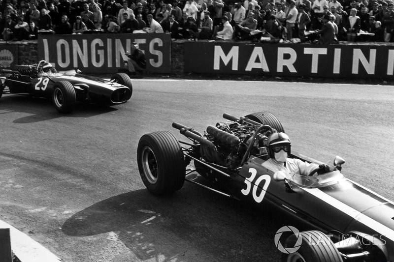 Pedro Rodriguez, Cooper T81-Maserati, leads Jochen Rindt, Cooper T81B-Maserati