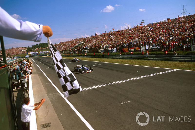 Damon Hill, Arrows A18 Yamaha crosses the line to take the chequered flag