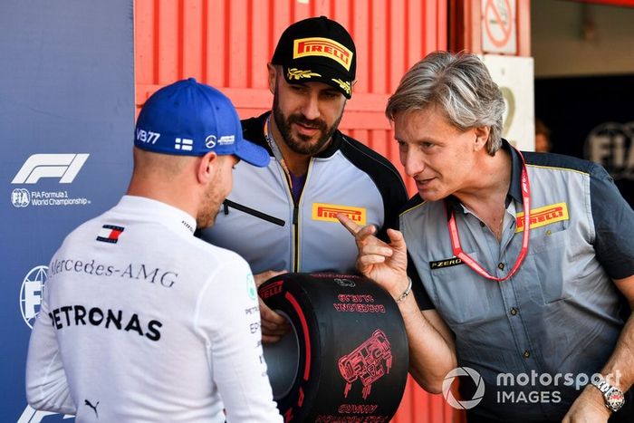 WWE wrestler Cesaro presents Valtteri Bottas, Mercedes AMG F1, with his Pirelli Pole Position award