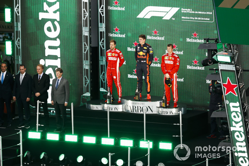 Sebastian Vettel, Ferrari, 2nd position, Max Verstappen, Red Bull Racing, 1st position, and Kimi Raikkonen, Ferrari, 3rd position, on the podium