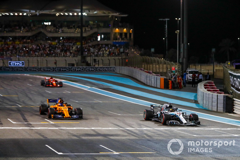 Lewis Hamilton, Mercedes AMG F1 W09 EQ Power+, Fernando Alonso, McLaren MCL33, and Sebastian Vettel, Ferrari SF71H, arrive on the grid after completing a celebration lap