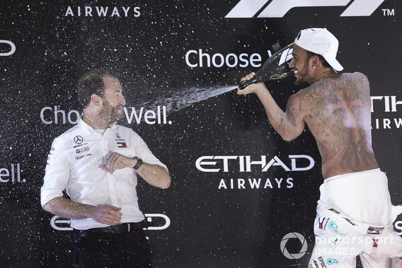 Lewis Hamilton, Mercedes AMG F1, 1st position, sprays Bradley Lord, Communications Director, Mercedes AMG, on the podium