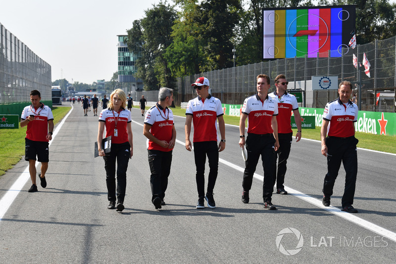 Charles Leclerc, Sauber walks the track and Ruth Buscombe, Sauber Race Strategist