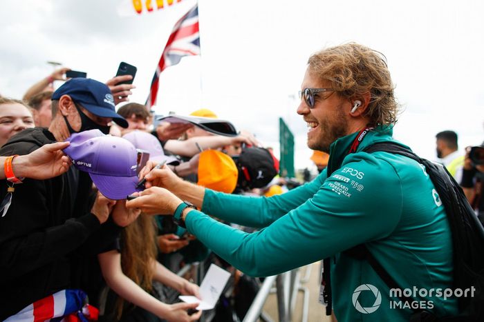 Sebastian Vettel, Aston Martin, signs autographs for fans