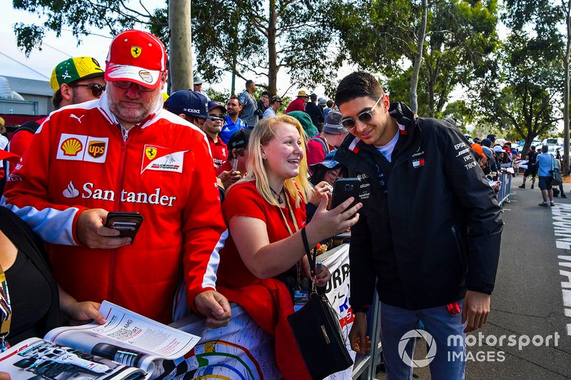 Esteban Ocon, Mercedes AMG F1 poses for a selfie with a fan.