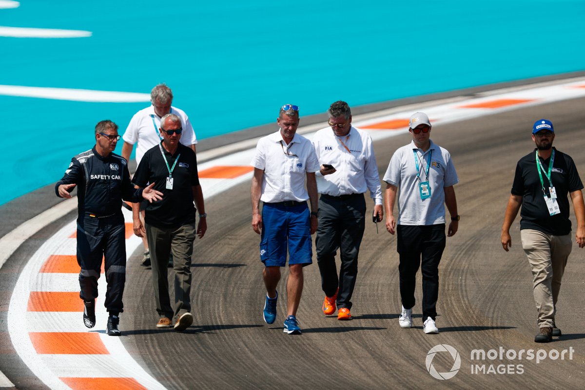 Officials, including Niels Wittich, Race Director, FIA, Bernd Maylander, Safety Car Driver, inspect the track