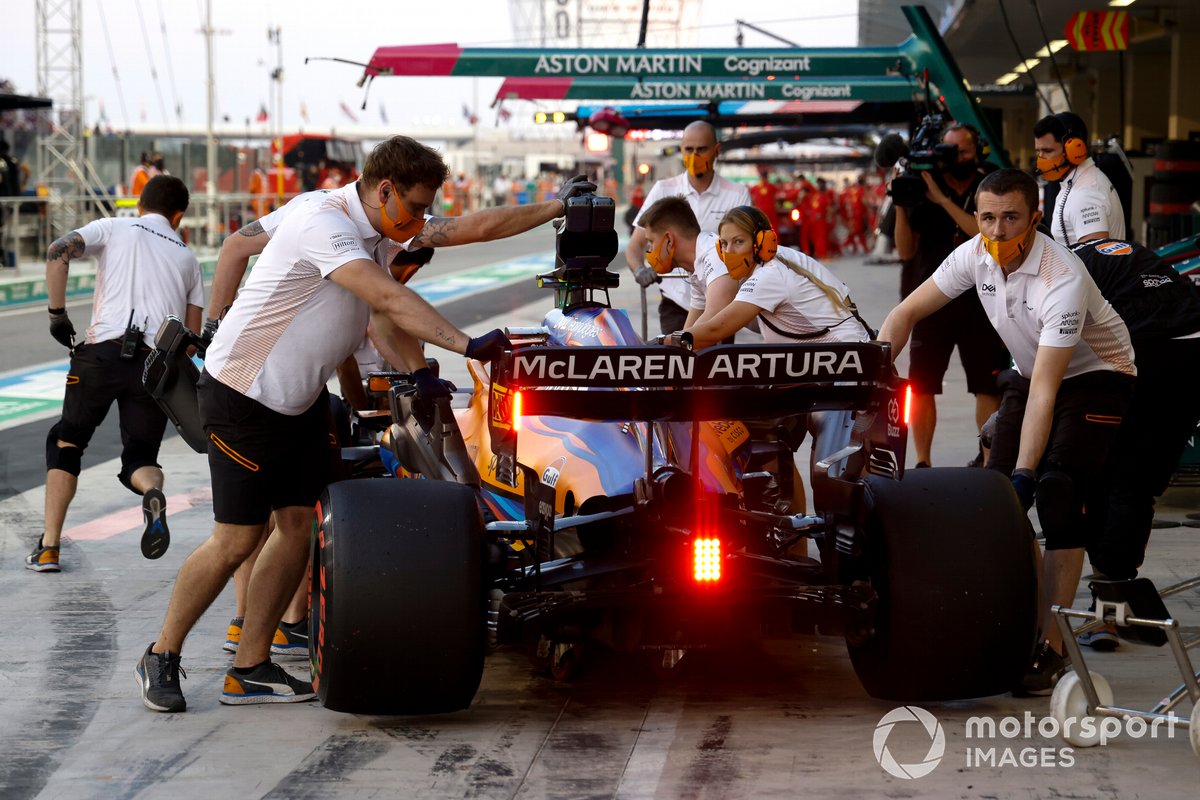 Daniel Ricciardo, McLaren, is returned to the garage