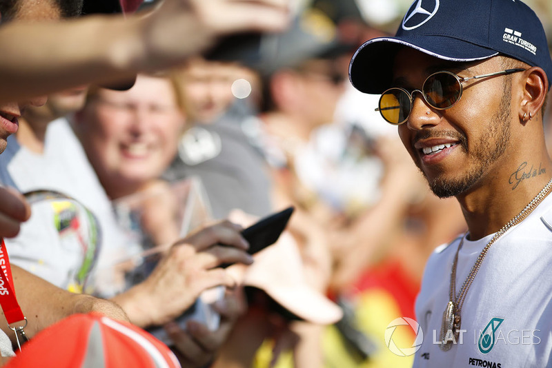 Lewis Hamilton, Mercedes AMG F1, signs autographs for fans
