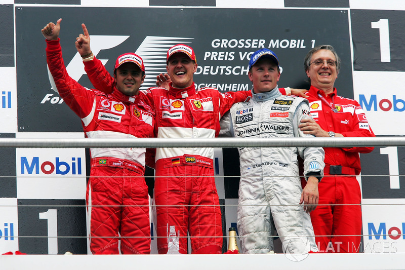 Podio: Felipe Massa, Ferrari, secondo; Michael Schumacher, Ferrari, vincitore della gara; Kimi Raikkonen, McLaren, terzo; Paolo Martinelli, Engine Director Ferrari